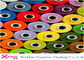 Alto hilado hecho girar de la tenacidad poliéster 100% para el hilo de coser en el Tinte-Tubo con colores multi proveedor